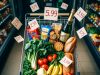 7 Silent Money Leaks That Are Draining Your Wallet Every Month. 🚰💸 An overhead view of a grocery cart showing planned essentials versus expensive, impulsive additions.