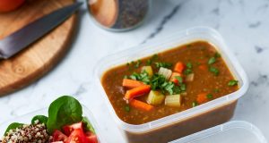 Grocery Hacks – Meal Prep on a $50 Weekly Budget Three prepared meal prep containers showcasing the variety of affordable meals: a grain bowl, soup, and a frittata.