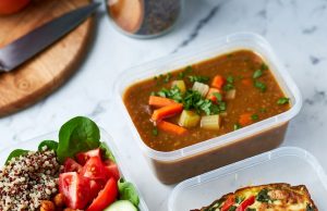 Grocery Hacks – Meal Prep on a $50 Weekly Budget Three prepared meal prep containers showcasing the variety of affordable meals: a grain bowl, soup, and a frittata.